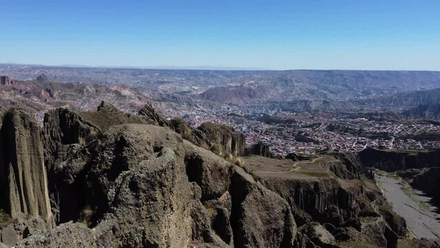 Aerial: La Paz, Bolivia seen from rugged Valle de las Animas spires