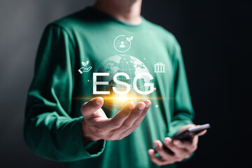 ESG environmental, social and governance concept. social business strategy, environment, business investment strategy. Person hold globe  with ESG icon for world sustainable environment concept.