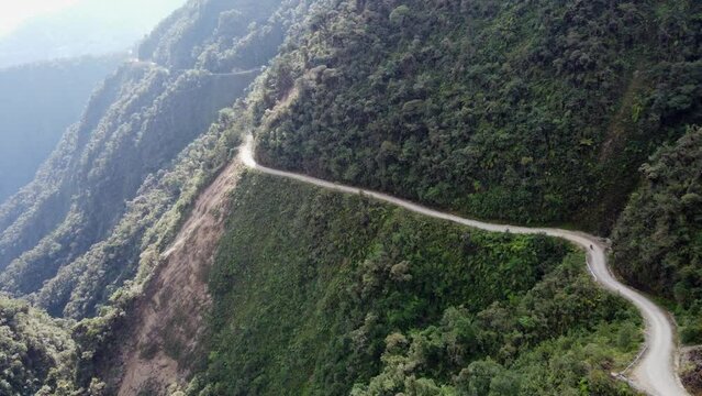 Stunning nature aerial: Cyclist on famous Death Road in Bolivian Andes