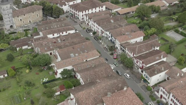 Ainhoa town center with Church of Our Lady of Assumption, Pyrenees Atlantiques, Nouvelle Aquitaine in France. Aerial top-down view
