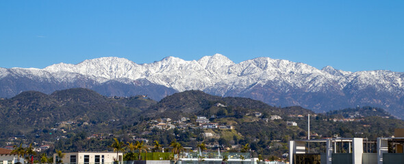 Fototapeta na wymiar Snowy Mountaintops in California, San Gabriel Mountains & Valley