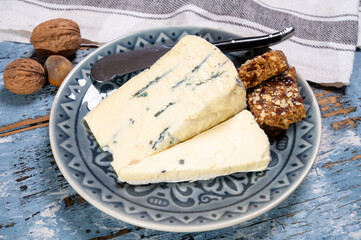 French goat cheese with black summer truffles mushrooms close up
