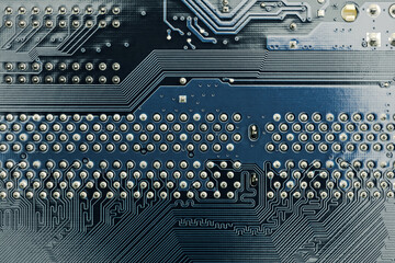 circuit board connections. back side of computer mother board. high-detailed background.