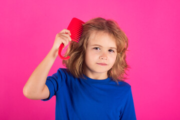 Comb and hair brush concept. Funny kids hairstyle. Kid brushing tangled hair. Funny kids haircut. - obrazy, fototapety, plakaty