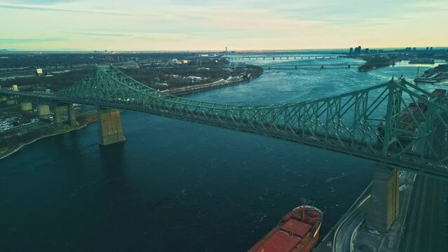 Montreal, Canada - Feburary 25 2024: Drone aerial view of Jaque Cartier Bridge over the Saint Laurant River in Montreal