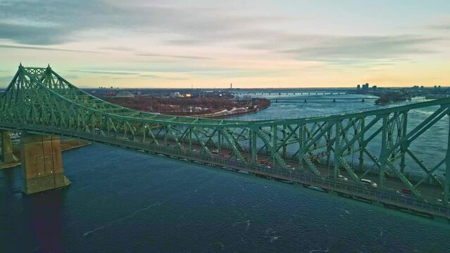 Montreal, Canada - Feburary 25 2024: Drone aerial view of Jaque Cartier Bridge over the Saint Laurant River in Montreal
