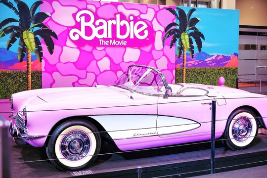 Toronto, Ontario, Canada - Feb 22, 2024: Pink 1957 Chevy Corvette Barbie car displayed in front of Barbie The Movie sign on Canadian International AutoShow at Metro Convention Centre.