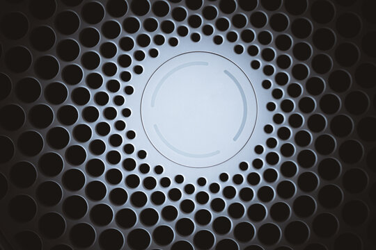 Close up of air purifier with circle in the middle and small holes