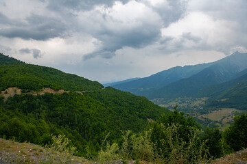 Obraz premium Melodies of Nature: Green Peaks Resonating Under the Blue Skies