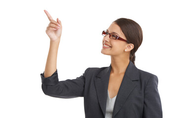 Face, smile and pointing with business woman in studio isolated on white background for planning. Future, vision and glasses with hand gesture of happy young employee in suit for corporate career