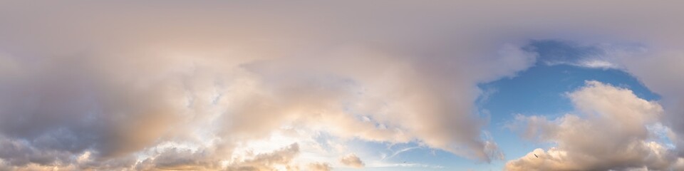 Sunset sky panorama with glowing golden Cumulus clouds. Seamless hdr 360 panorama in spherical...