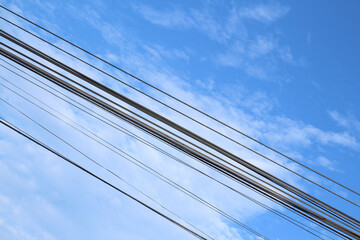 blue-sky electricity with awesome clouds at morning-afternoon. Electric wire,  viewed over blue sky.
