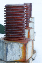 Rusty bolts in snow