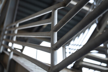Metal overpass platform with banister structure of the factory place. Industrial building part....