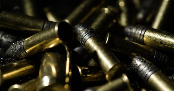 Pile Of Shiny .22 Long Rifle Bullets. Caliber Rimfire Ammunition. closeup shot