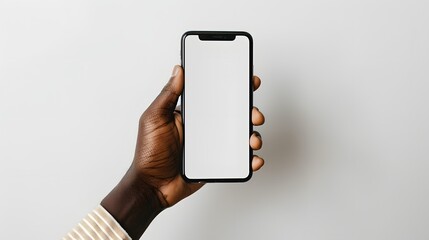 A black hand holding mobile cell phone with blank screen for mockup design prototype isolated on a white background	