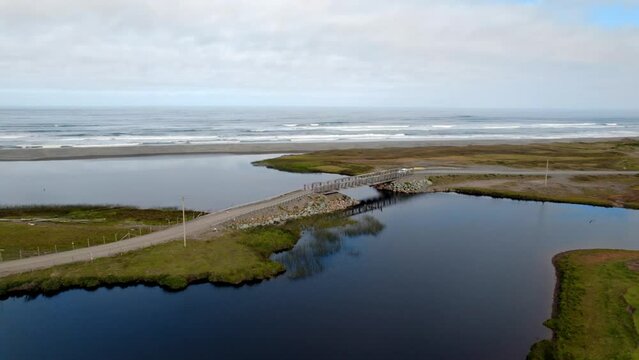 Aerial view of a truck passing the Puente De Bote bridge in Cucao, Chilo&eacute;, Chile