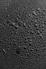 Water drops on a black background. Texture - 745565421