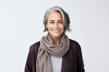 Portrait of a beautiful senior woman with grey hair smiling at the camera - obrazy, fototapety, plakaty