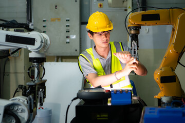 A technician suffers a hand accident while working with a robot arm in a factory with co-workers...