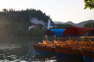 Pletna rowing boats on the alpine Bled lake, Slovenia, Europe