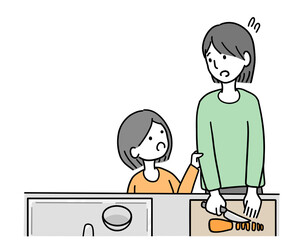 忙しく料理をしている母親と話しかける女の子