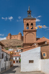 Fototapeta premium The village La Calahorra, in the province of Granada, Spain with Castillo de La Calahorra on top of hill. It is situated in the Sierra Nevada foothills.