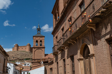 The village La Calahorra, in the province of Granada, Spain with Castillo de La Calahorra on top of hill. It is situated in the Sierra Nevada foothills.