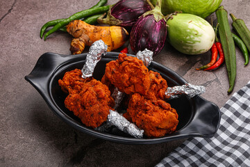 Indian cuisine glazed chicken lollipop