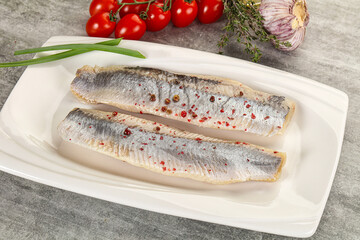 Marinated herring fillet with green onion