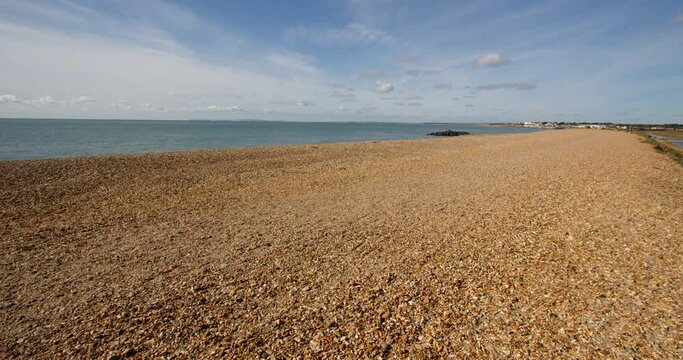 longshot looking down hurst spit with sea and Milford on sea in background