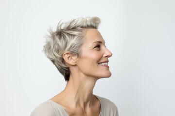 Portrait of a happy middle-aged woman with short gray hair