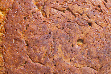 Surface of baked dough close-up. Baking texture.