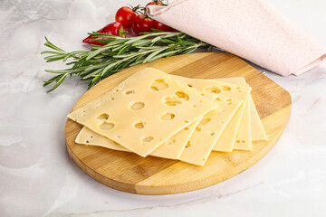 Sliced maasdam cheese with holes