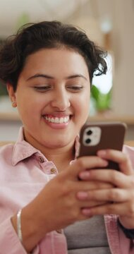 Happy woman, typing and phone on sofa for social media, reading website and chat or networking at home. Young person or online user laughing on mobile communication, texting on the internet in lounge