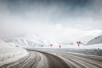Fotobehang snow winter mountain road. blizzard. © tarasov_vl