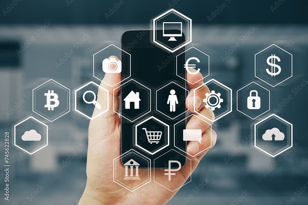 Poster Close up of businessman hand holding smartphone with abstract hexagonal pattern hologram with various business icons on blurry office interior background. Digital data concept. Double exposure.