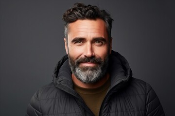 Portrait of a stylish bearded man in a warm jacket. Men's beauty, fashion.