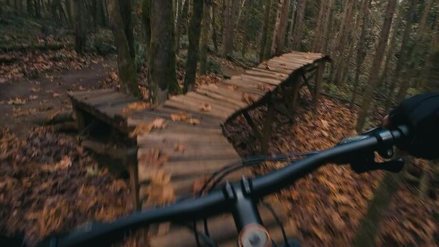 Mountain Bike Park Skills Balancing Over Wood Obstacle