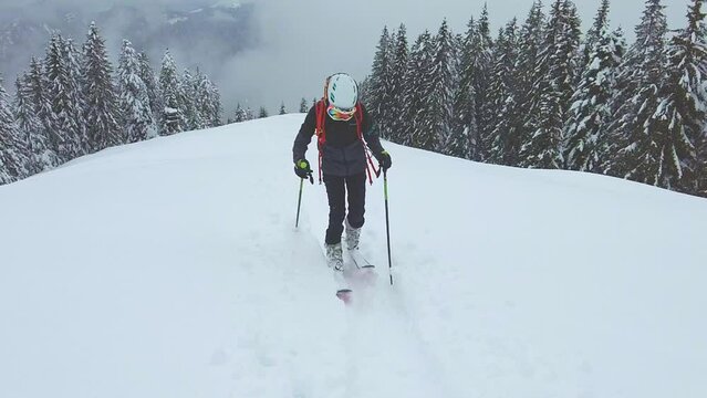 Child climbs on sealskin skis