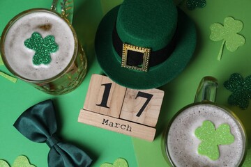 St. Patrick's day party on March 17. Green beer, leprechaun hat, bowtie, wooden block calendar and...