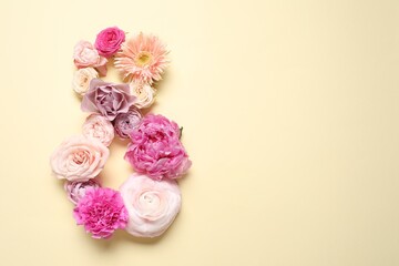 8 March greeting card design made with beautiful flowers on light yellow background, top view. Space for text
