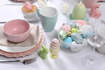 Festive table setting with painted eggs. Easter celebration