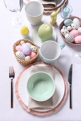 Festive table setting with painted eggs. Easter celebration
