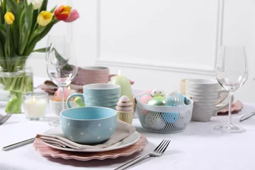 Fotobehang Festive table setting with painted eggs. Easter celebration © New Africa