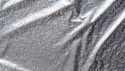 Silver background foil. Silver texture; metal iron holographic abstract macro
