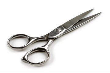 Obraz premium Close-up of a stainless steel scissors isolated on white background