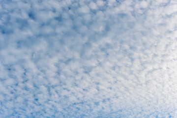 cloudy sky background for wallpaper and design, day skyscape with white beautiful clouds and blue...