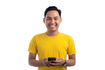Portrait of happy handsome Asian man using smartphone for trading or chatting, looking at camera and smiling isolated on white background