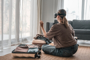 Travel,woman packing luggage in suitcase and travel in VR glasses nature,virtual reality exercise,...